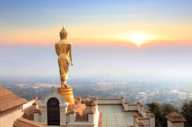 Things to do in Nan, Thailand: Gazing into the sun with the Blessing Buddha at Wat Phra That Khao Noi