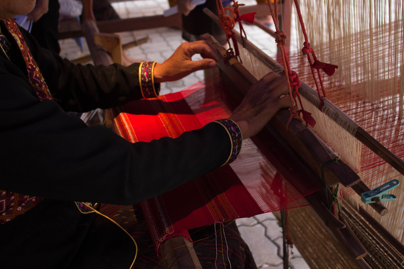 Thai textiles: Phu Tai woman weaving Phrae Wa silk in Kalasin